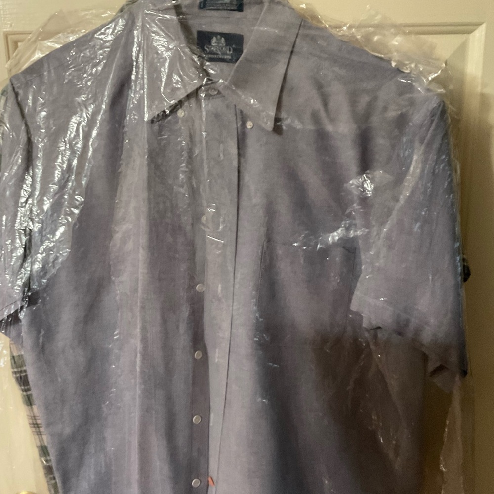 Like new dress shirt has been dry cleaned and comes from a smoke free home